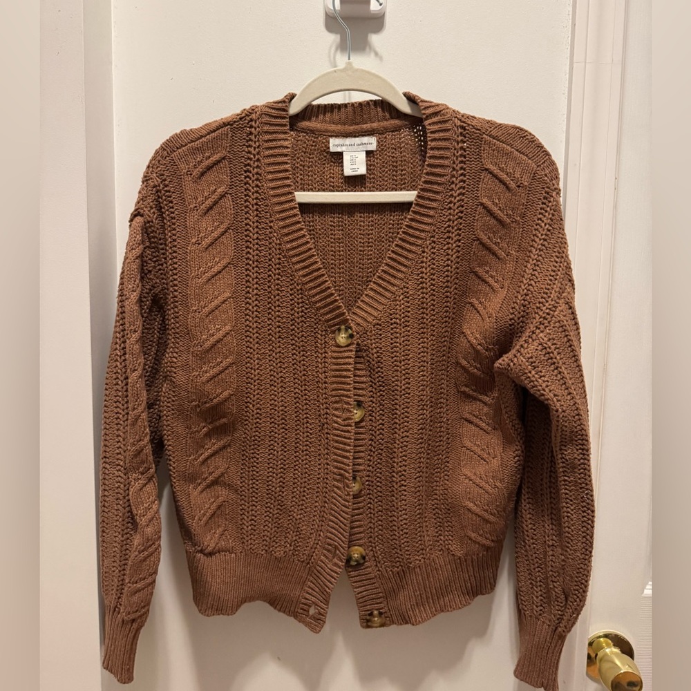 Cupcakes and cashmere cardigan.